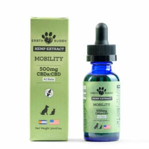 Green box next to blue bottle of Earth Buddy Mobility Extract with CBDa for dogs. CBDa helps with arthritis in dogs.