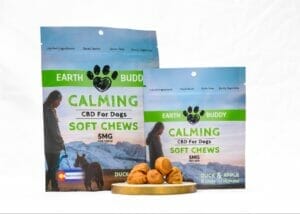 Earth Buddy Duck & Apple Calming Chews for Dogs with 5mg of CBD in blue and green packaging for calming dog stress. 