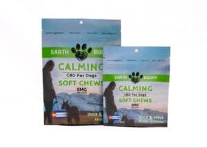Earth Buddy Duck & Apple CBD dog treats in blue and green packages. CBD calming treats for dogs are great for anxiety. 