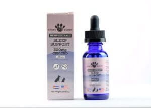 Pink box of Earth Buddy Sleep Support next to a bottle of CBN tincture that promotes restful sleep in dogs and cats. 